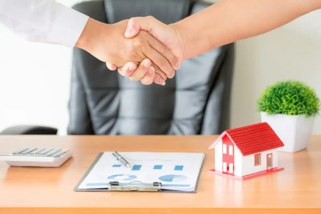hands agent client shaking hands after signed contract buy new apartment