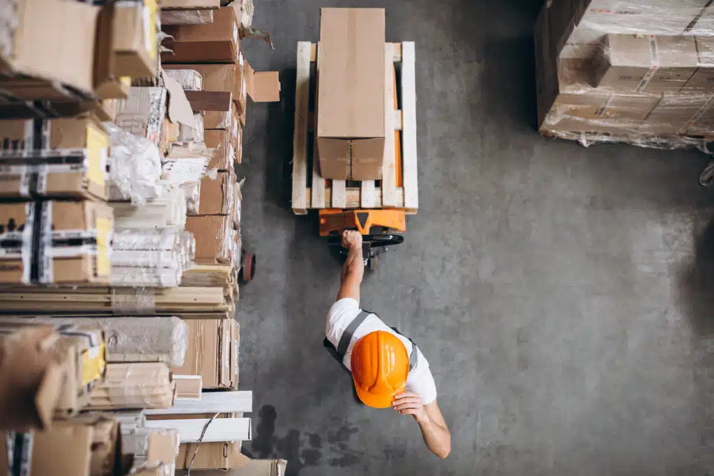 young man working warehouse with boxes4
